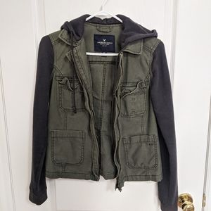 Army green jacket with sweater layering detail